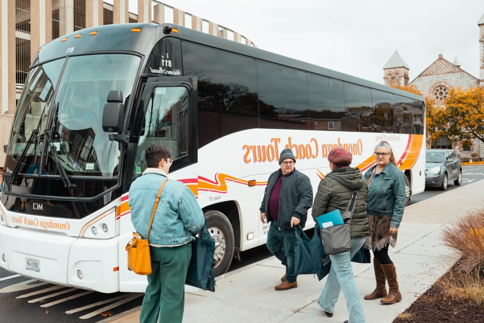 Group of People boarding a bus